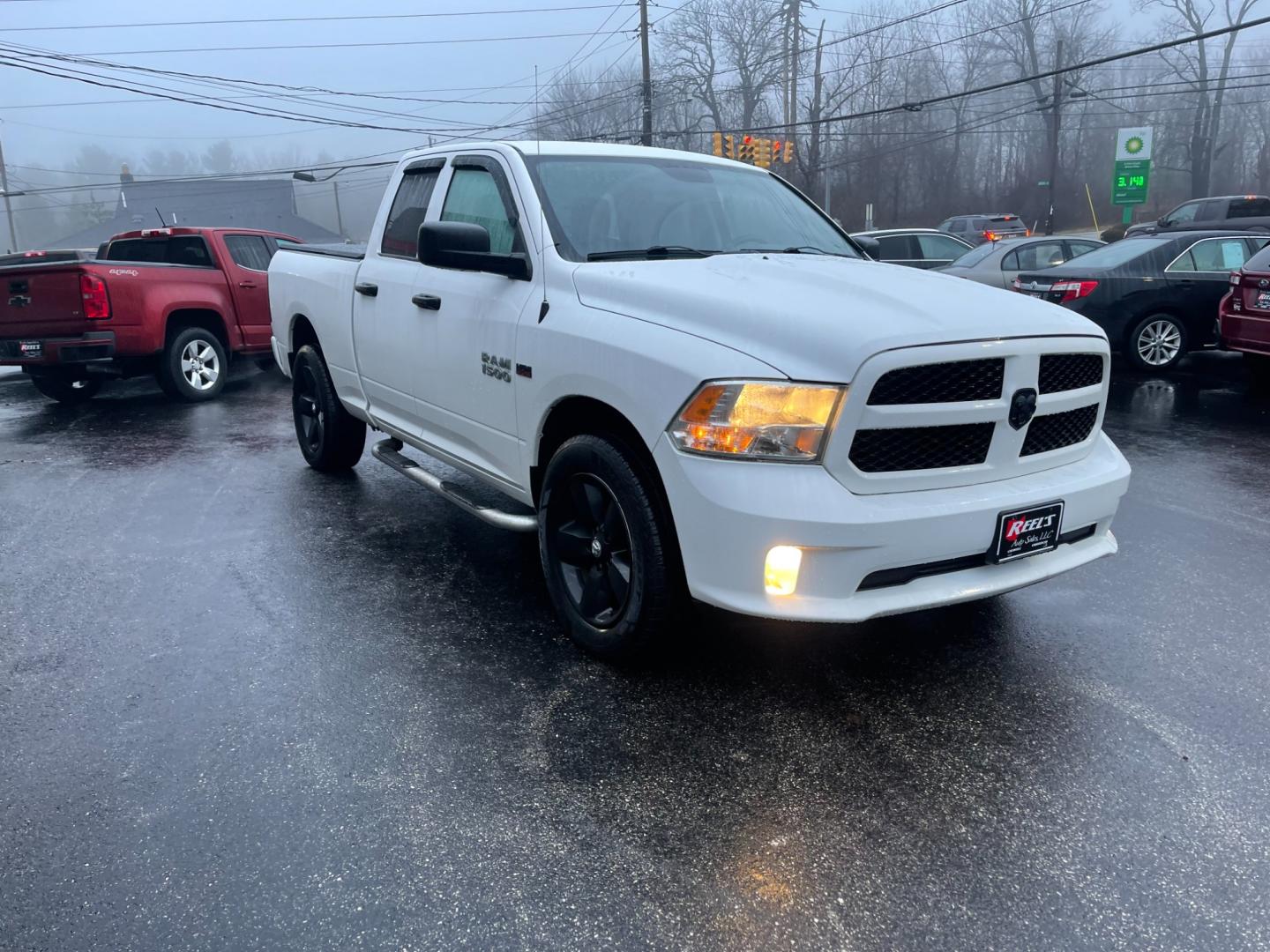 2014 White /Black RAM 1500 Express Quad Cab 4WD (1C6RR7FT5ES) with an 5.7L V8 OHV 16V engine, 8-Speed Automatic transmission, located at 11115 Chardon Rd. , Chardon, OH, 44024, (440) 214-9705, 41.580246, -81.241943 - Photo#2